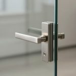 Modern glass office door with stainless steel D handle installed