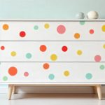 freepik__white-dresser-covered-in-multicolor-polka-dots-of-__82113
