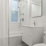 A before-and-after split image showing a messy, outdated bathroom on the left and a clean, renovated bathroom with white tiles and a modern shower on the right