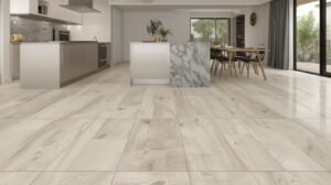 A beautiful modern kitchen with large-format porcelain tile flooring, showing clean grout lines and a seamless transition from the kitchen to a dining area.
