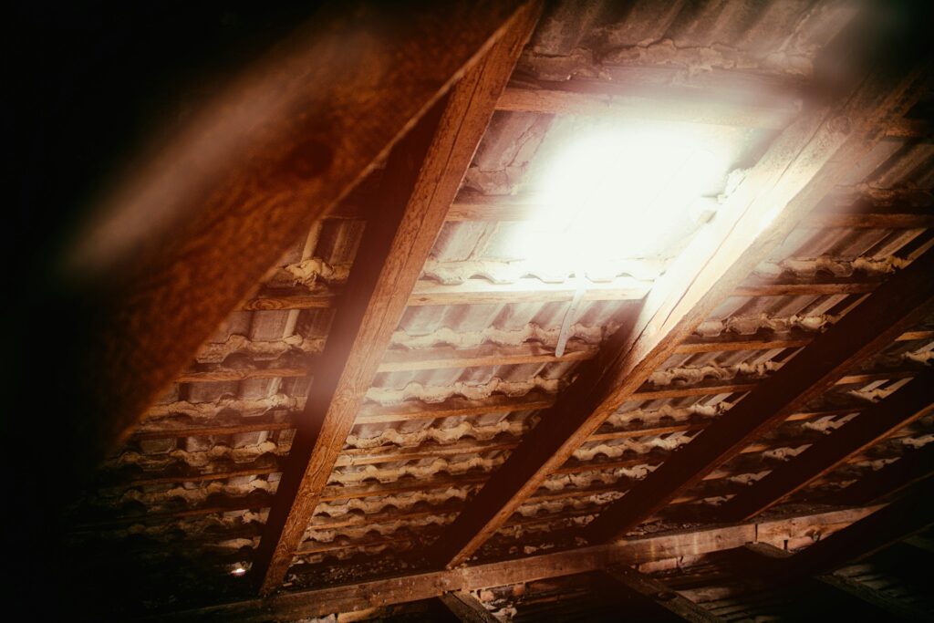 Homeowner adding insulation to attic