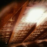 Homeowner adding insulation to attic