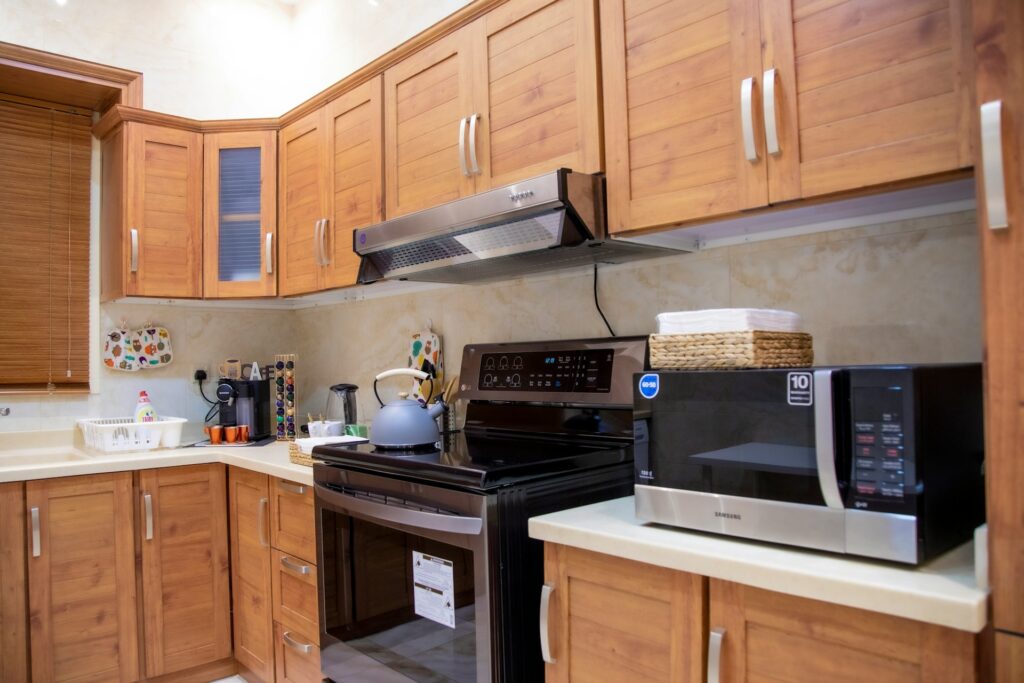 Kitchen with poor cabinet placement before renovation correction